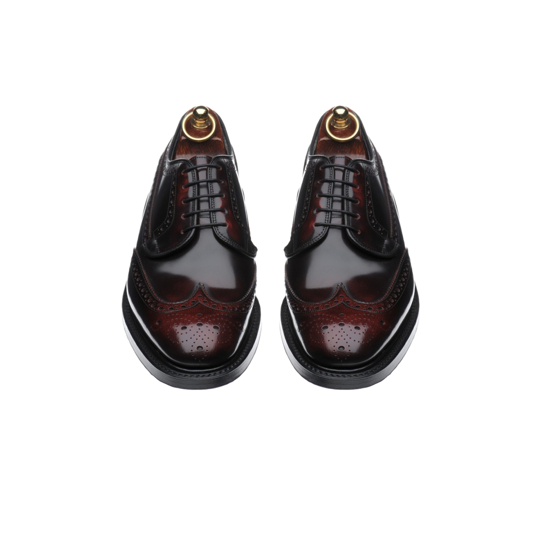 Oxblood leather wingtip brogues on cedar shoe trees
